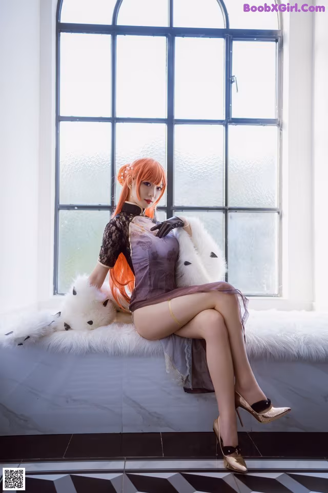 A woman sitting on a window sill with a teddy bear.